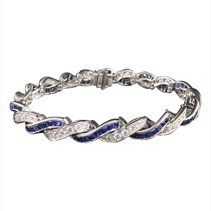 ladies-modern-charm-link-bracelets-Platinum Sapphire and Diamond Criss Cross Bracelet