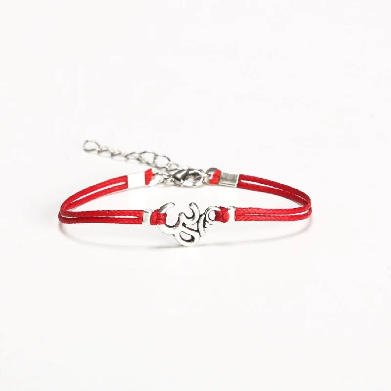 ladies-rope-twist-pearl-bracelets-Women bracelet with a silver tone Om charm, red cord, yoga jewelry